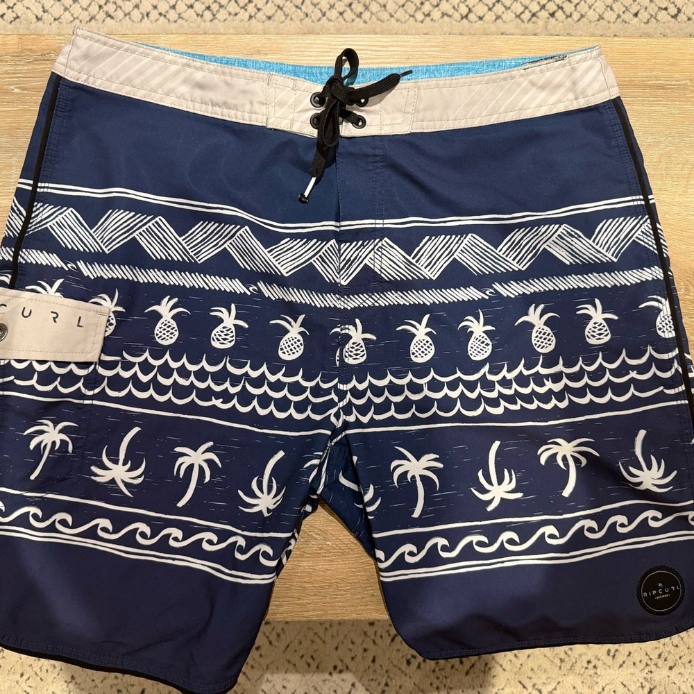 Rip Curl Blue and White Board Shorts with Tropical Patterns